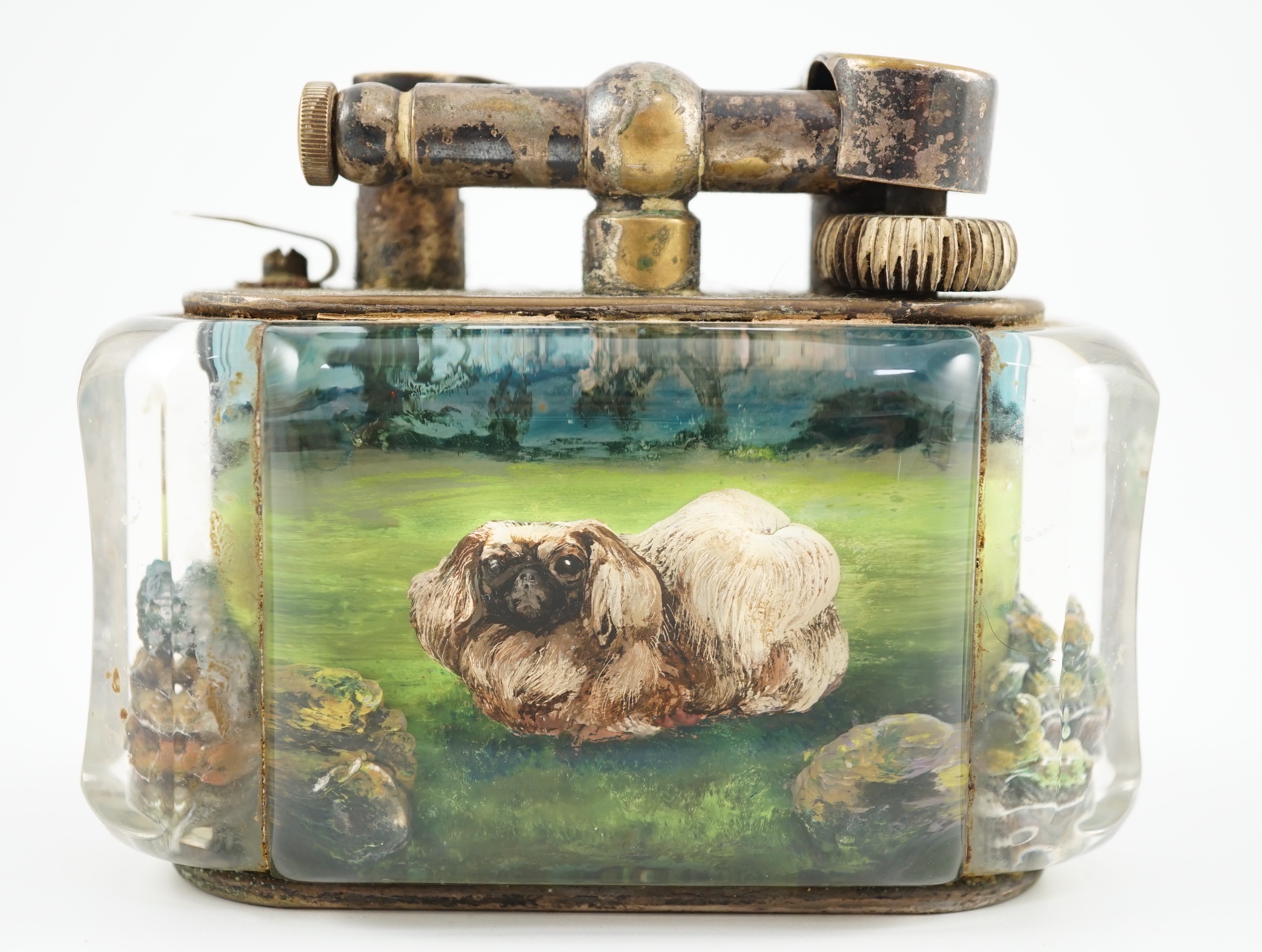 A rare Dunhill lucite cigarette lighter with unusual decoration of a Pekingese dog, width 10cm depth 5cm height 7.5cm